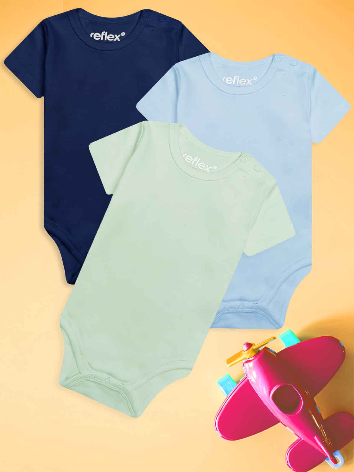 Wholesale shop selling Three baby bodysuits in navy, light blue, and green with 'reflex' branding on a yellow background.